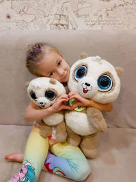 Little Girl with 2 Toffy Pandas and a Heart Sign
